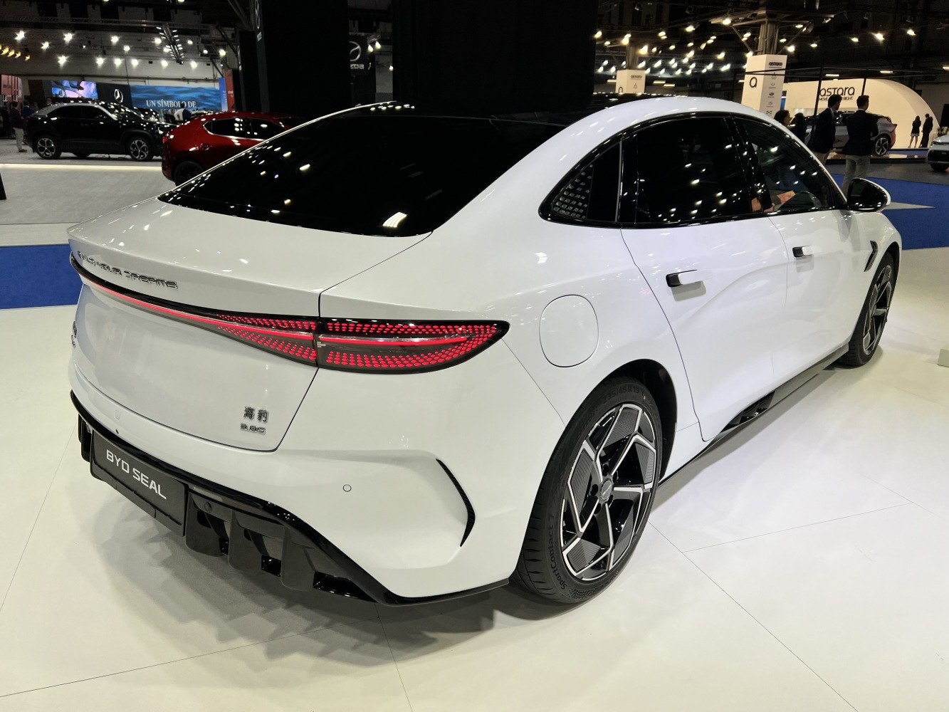Rear and side view of sleek electric sedan with unique taillights and aerodynamic shape