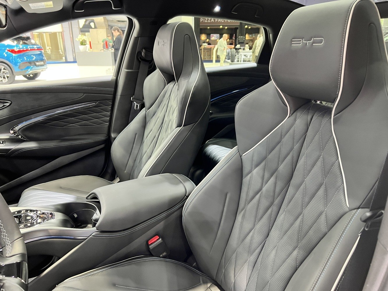 Quilted leather front seats with embroidered headrests and central armrest