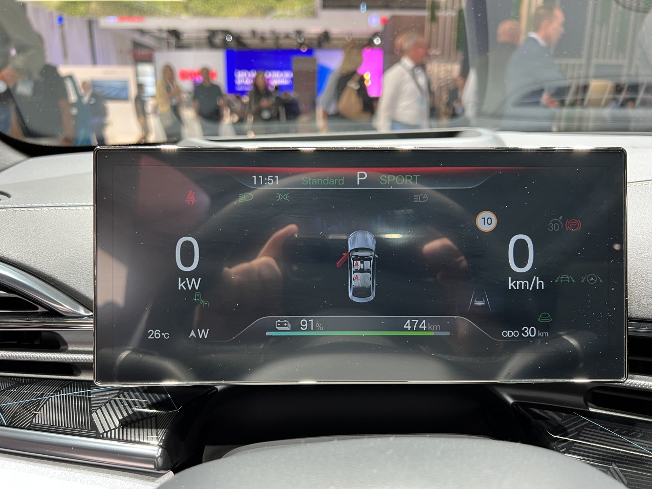 Digital instrument cluster showing speed, battery, and driving mode