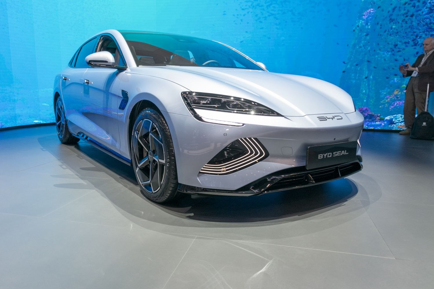 Close-up on modern electric sedan front with LED headlights and aerodynamic lines