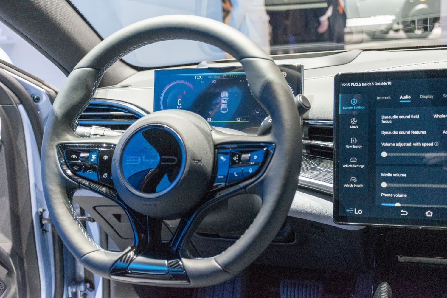 Steering wheel with controls and digital instrument cluster plus touchscreen infotainment system