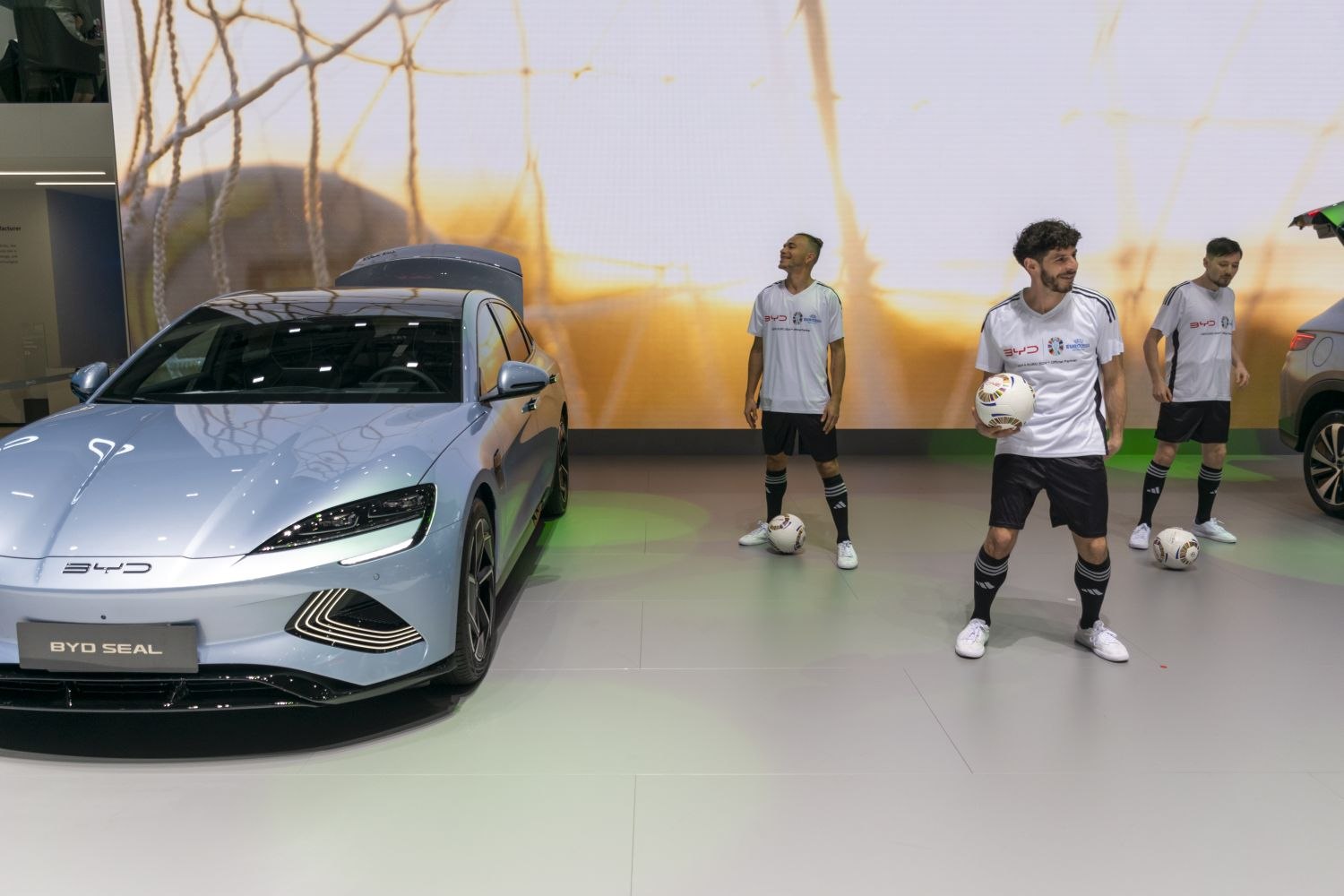 Front view of electric sedan with sleek LED headlights