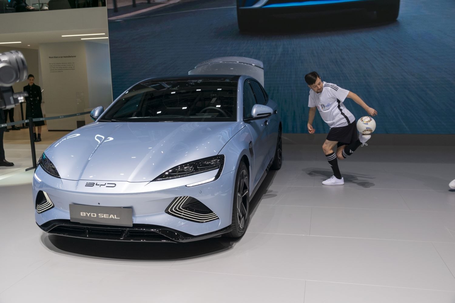 Front view of electric sedan with LED headlights and aerodynamic design