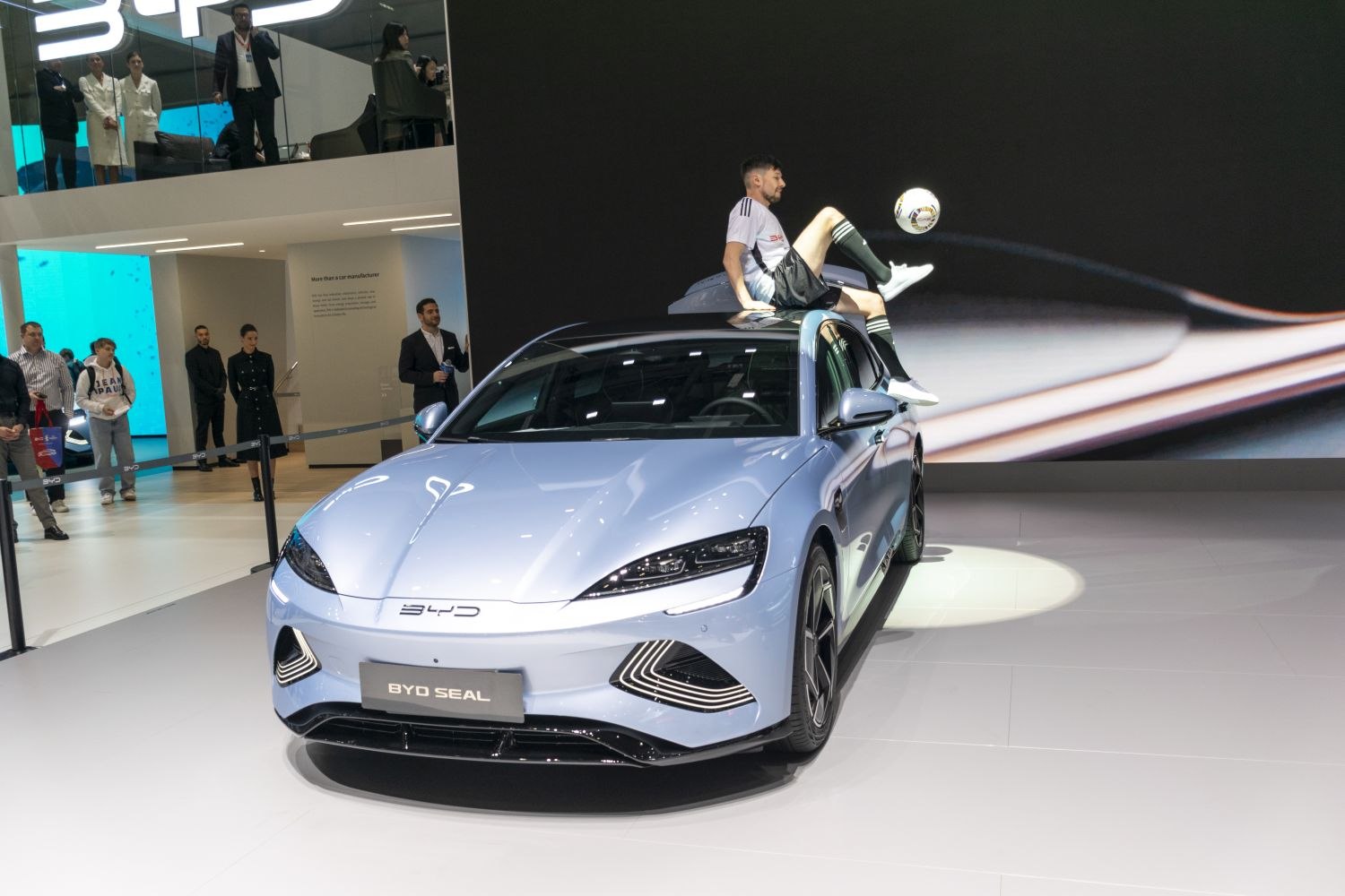 Sleek electric sedan front with LED headlights and aerodynamic styling