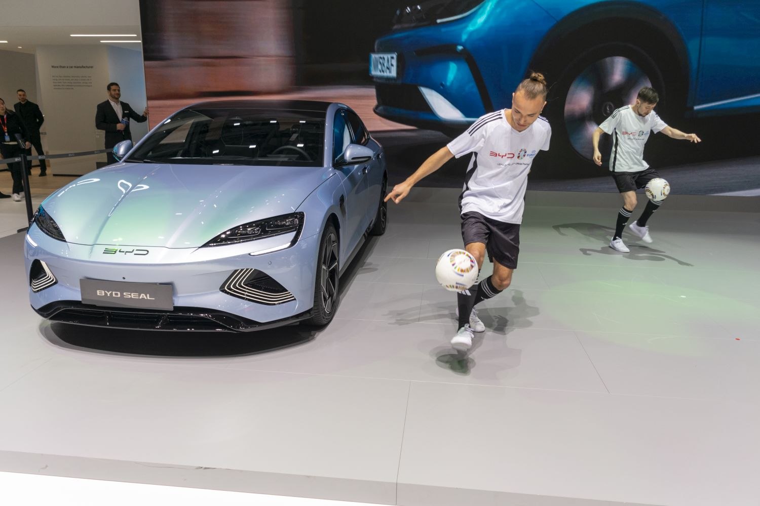Front view of modern electric sedan with sleek headlights and distinct grille design
