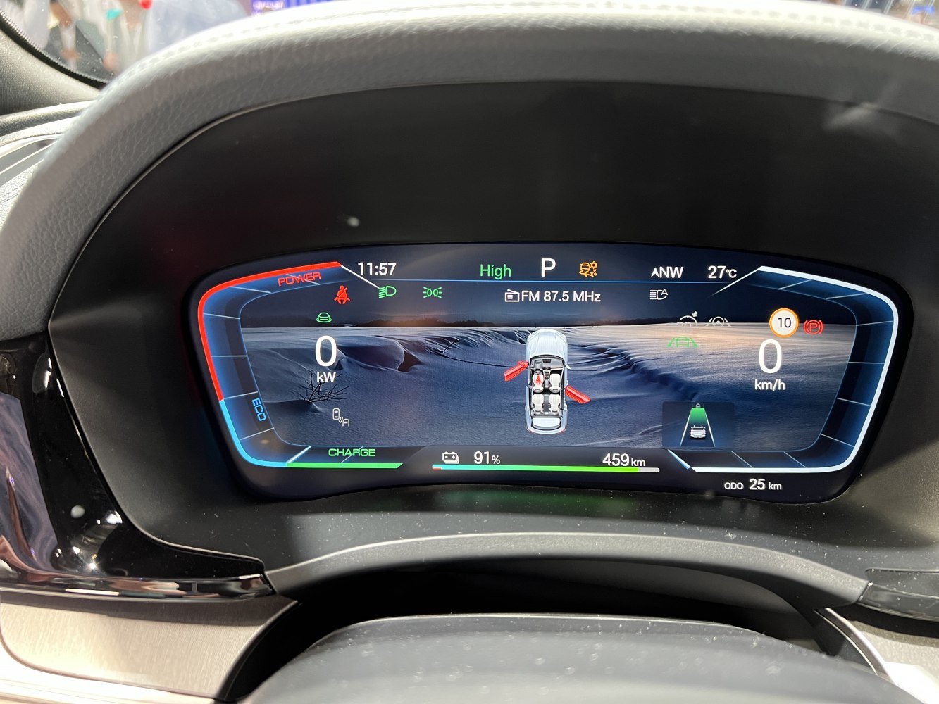 High-tech digital instrument cluster showing power, speed, battery charge, and driving status.