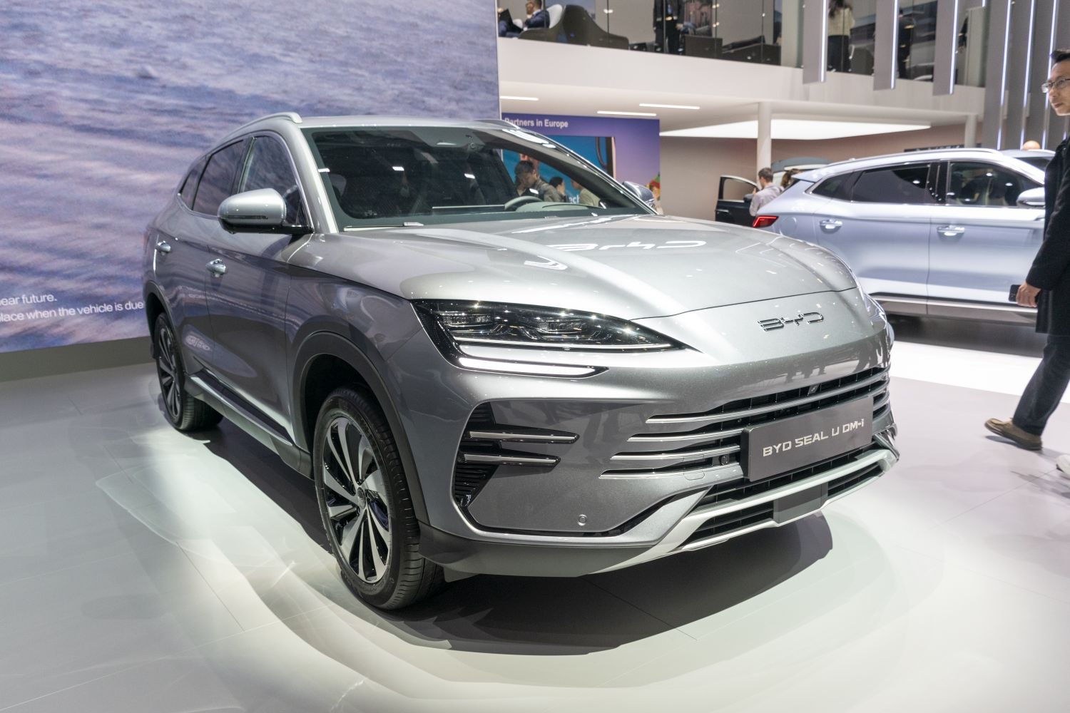Front view with sleek LED headlights and modern grille