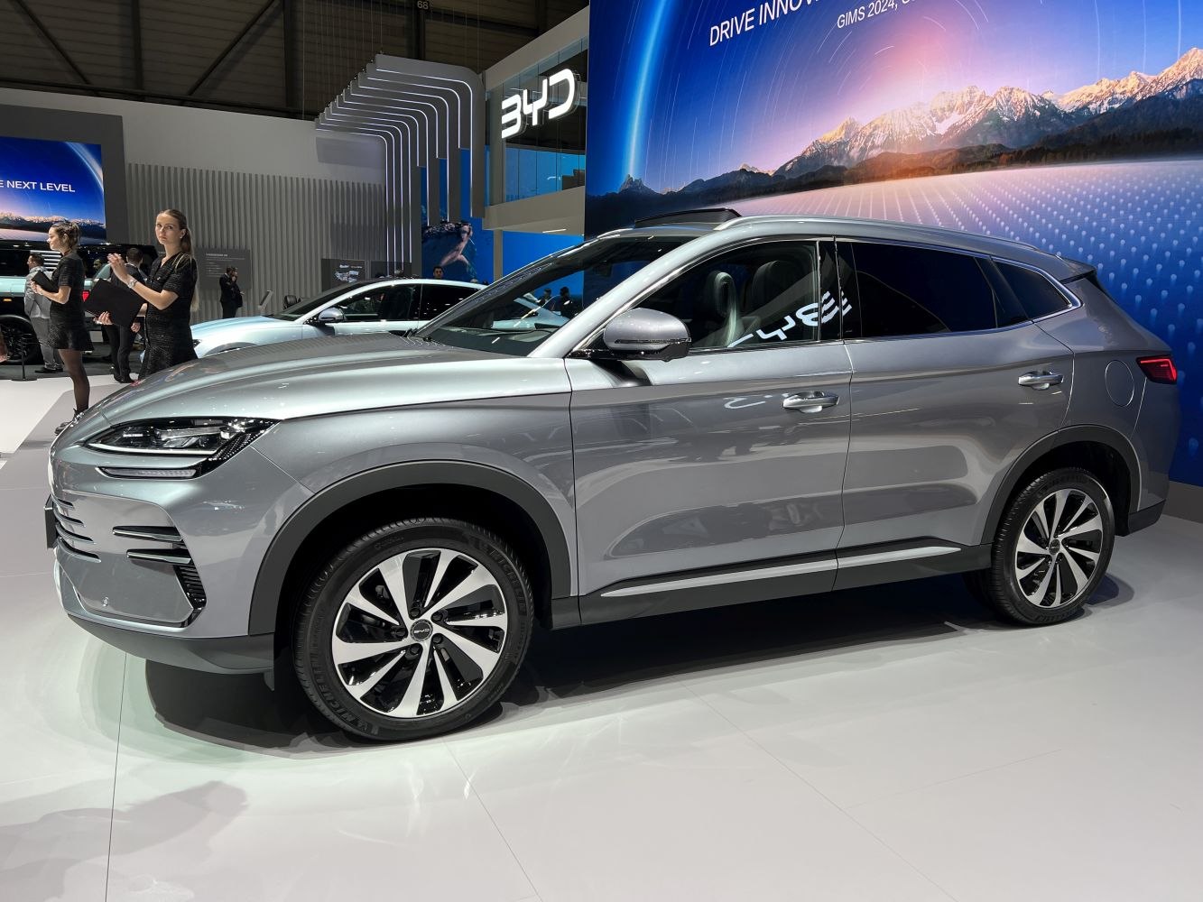 Side profile of a sleek SUV with LED headlights and alloy wheels