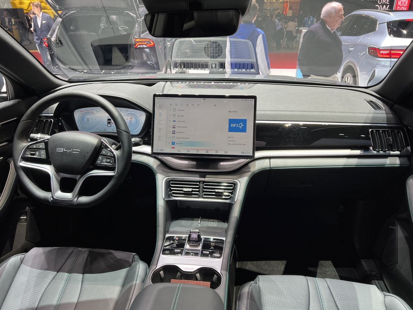 Digital dashboard and large central touchscreen display in car interior