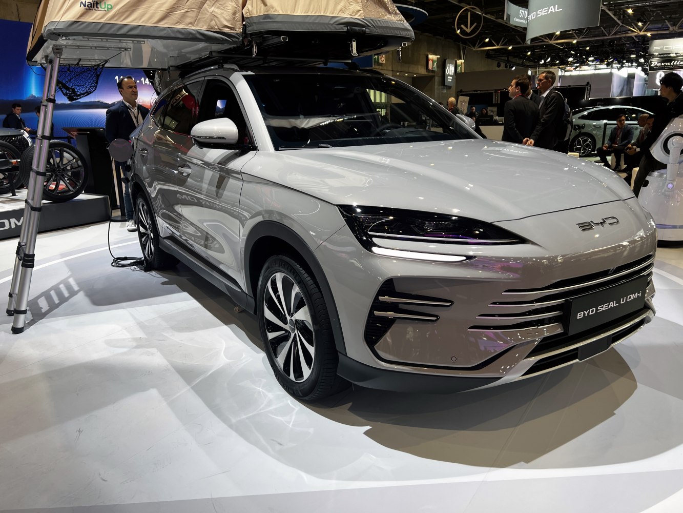 Electric SUV with LED headlights, aerodynamic grille, and alloy wheels