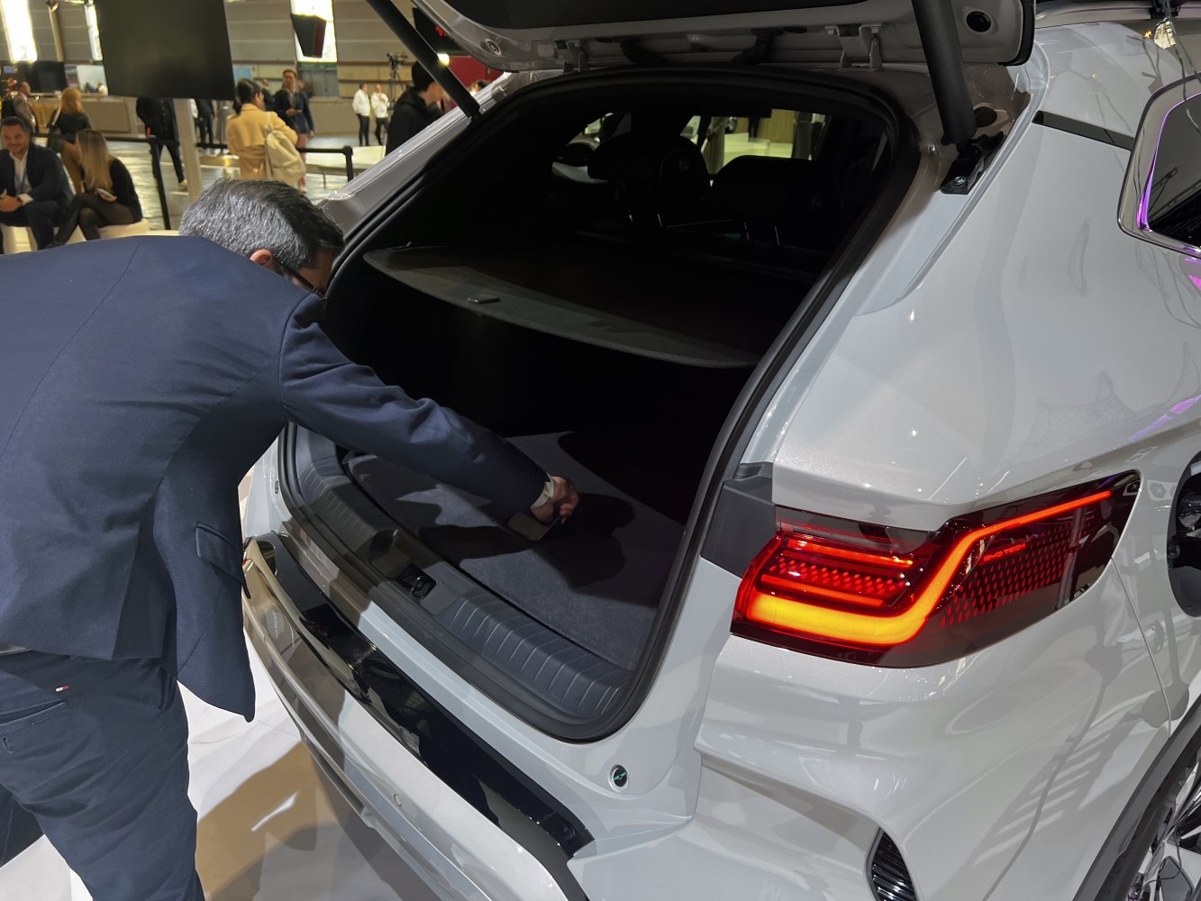 Spacious rear cargo area with open trunk and illuminated taillights