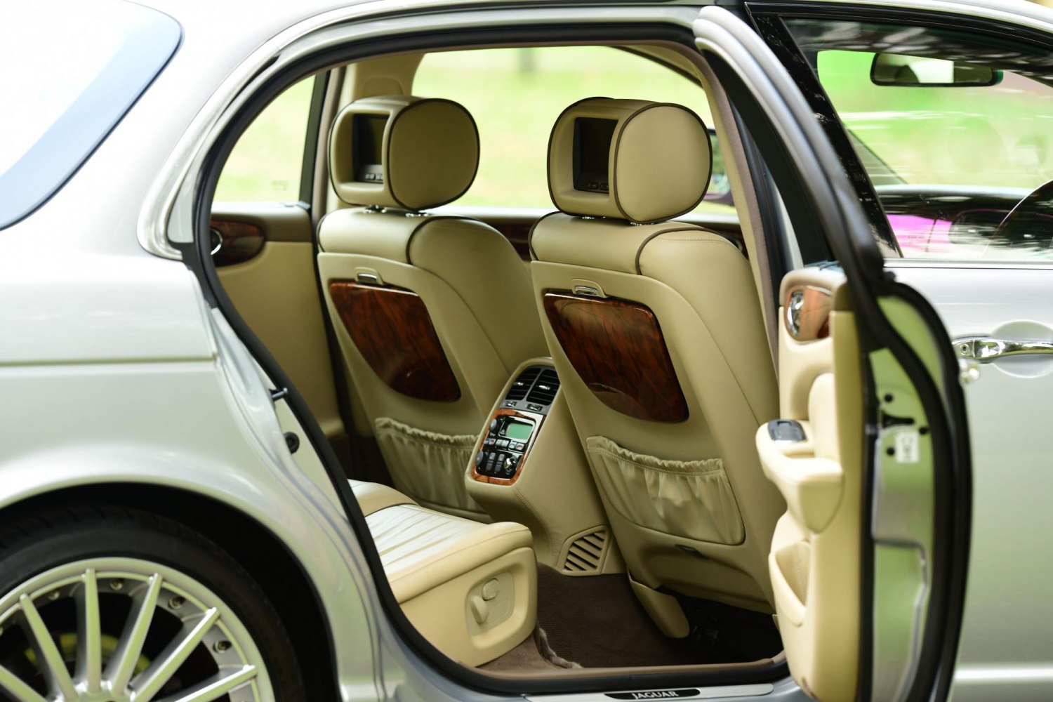 Rear seats with headrest monitors and wood trim panels