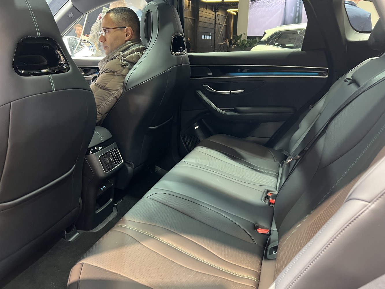 Rear leather seats with air vents and modern door panel