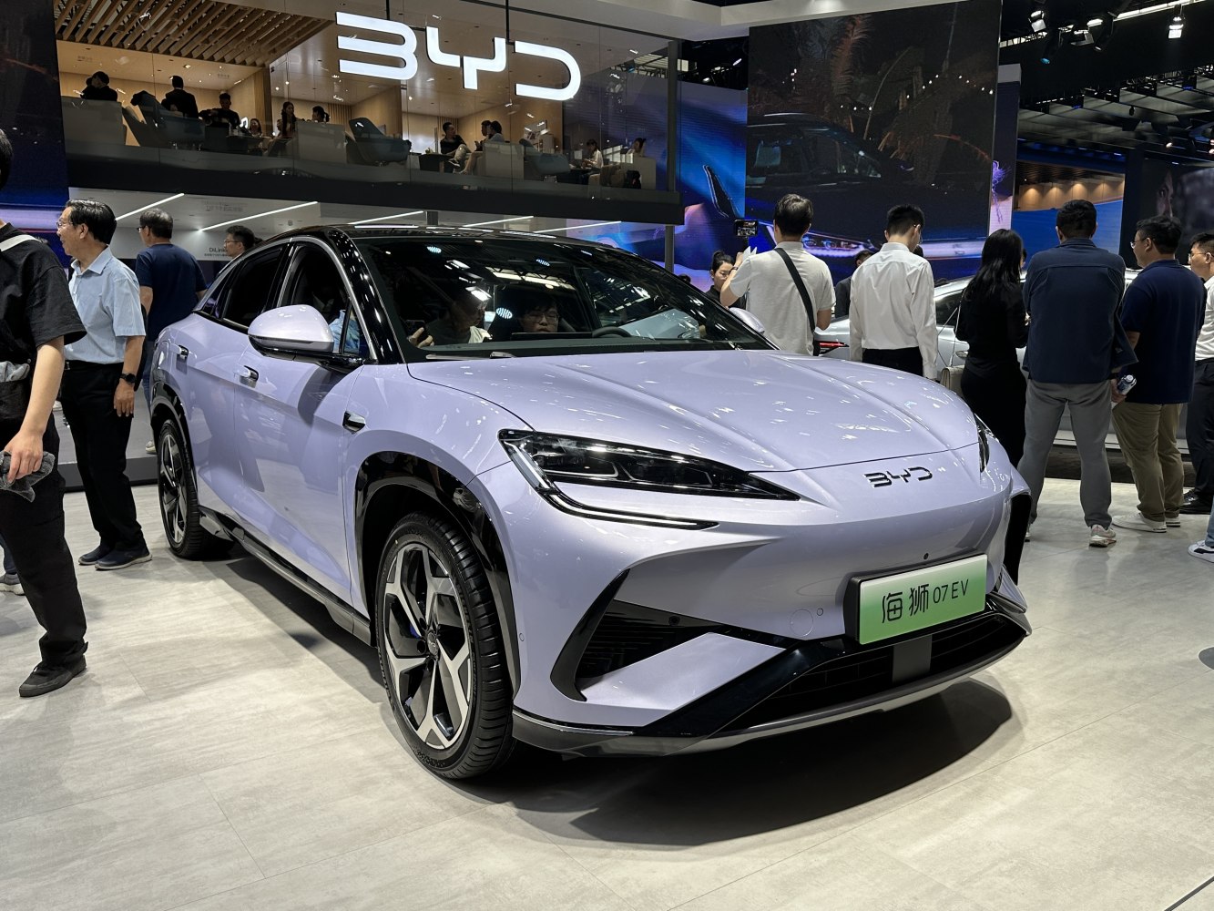 Front view of a modern electric SUV with sleek headlights and aerodynamic design