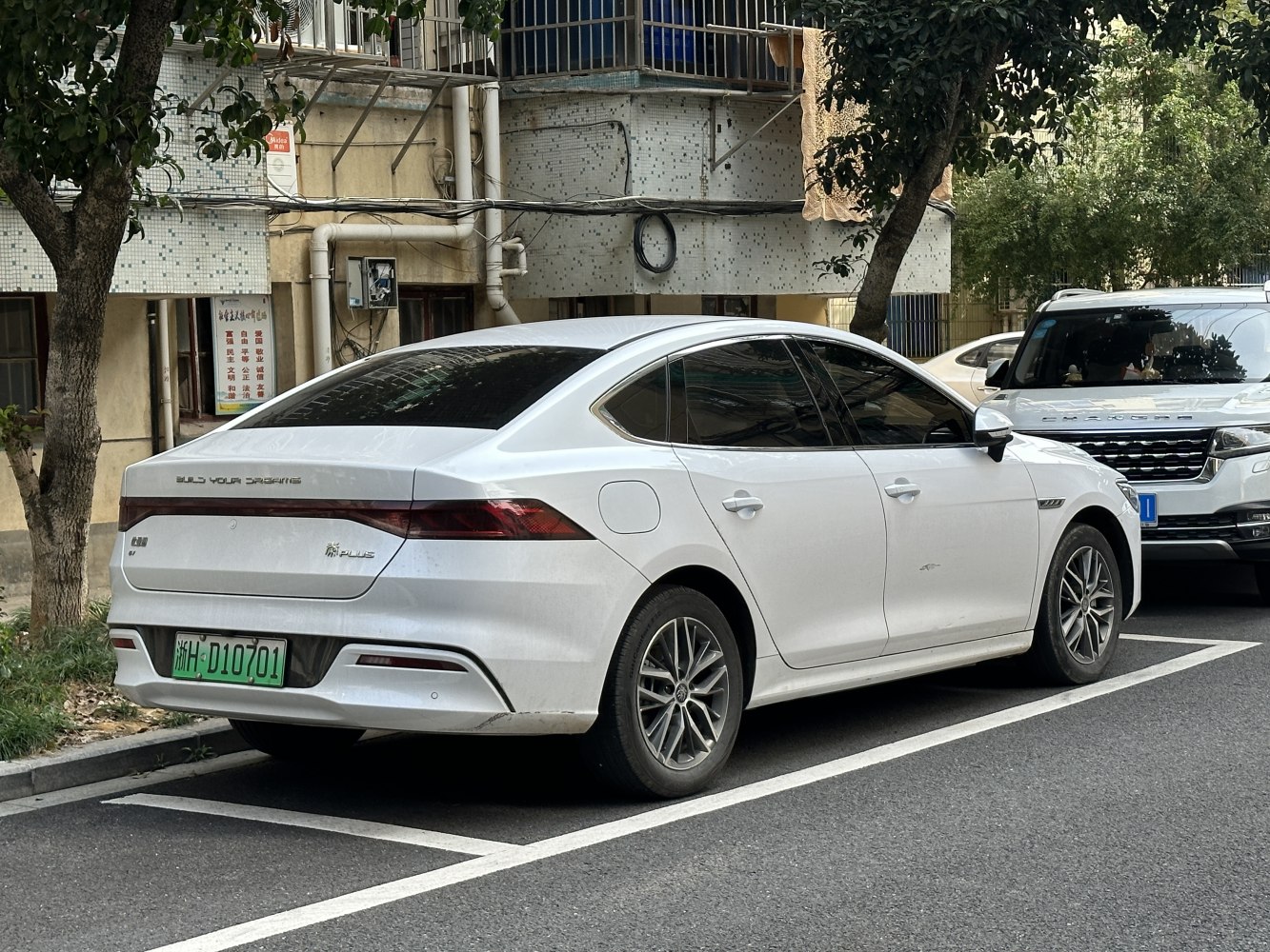 White sedan with sleek rear and connected tail lights