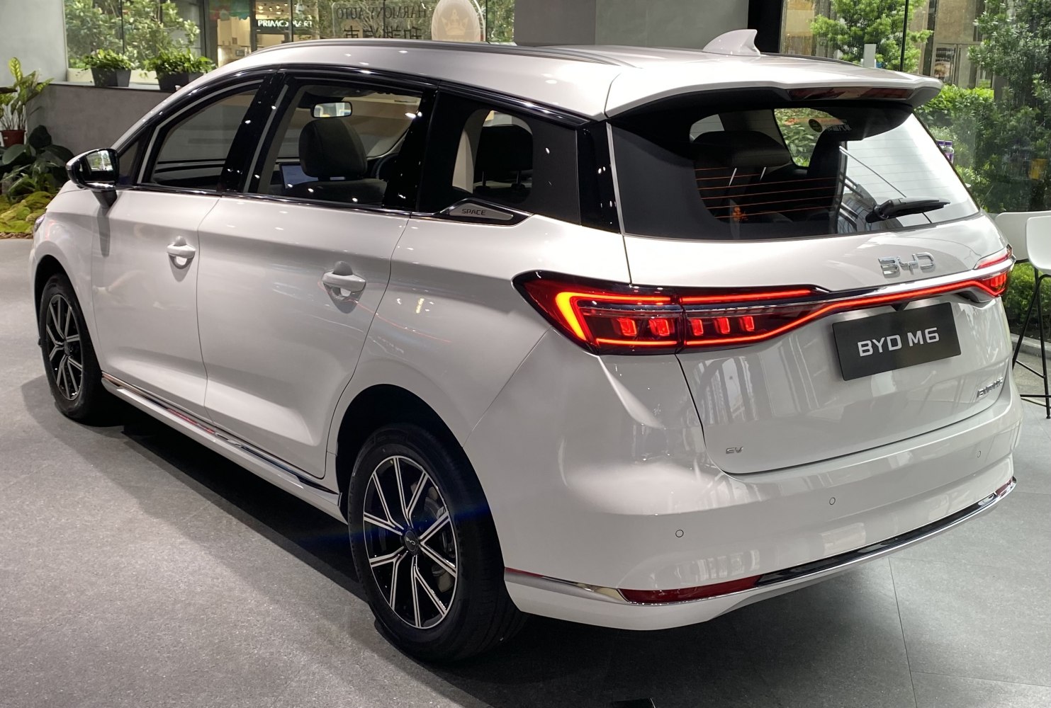 Rear side view with LED tail lights and sleek modern design