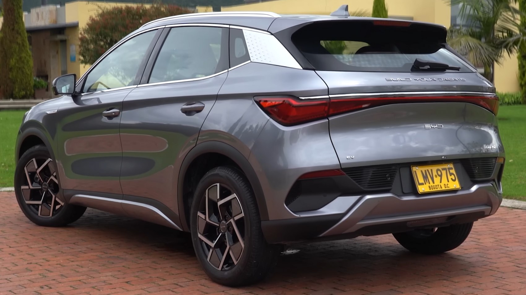 Rear three-quarter view with alloy wheels and LED taillight