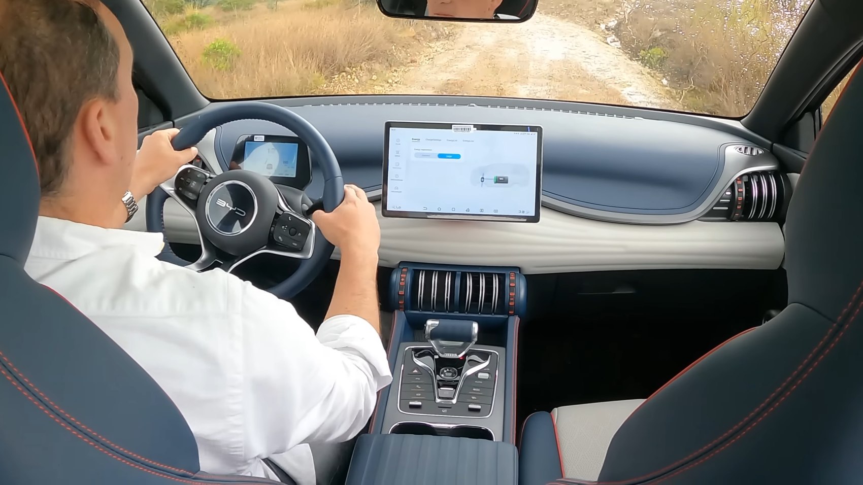 Digital instrument cluster and touchscreen center display in modern car interior
