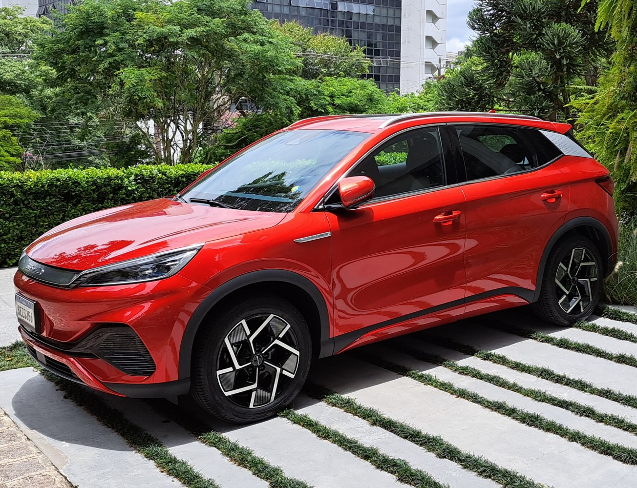 Red electric SUV with sleek body and modern alloy wheels
