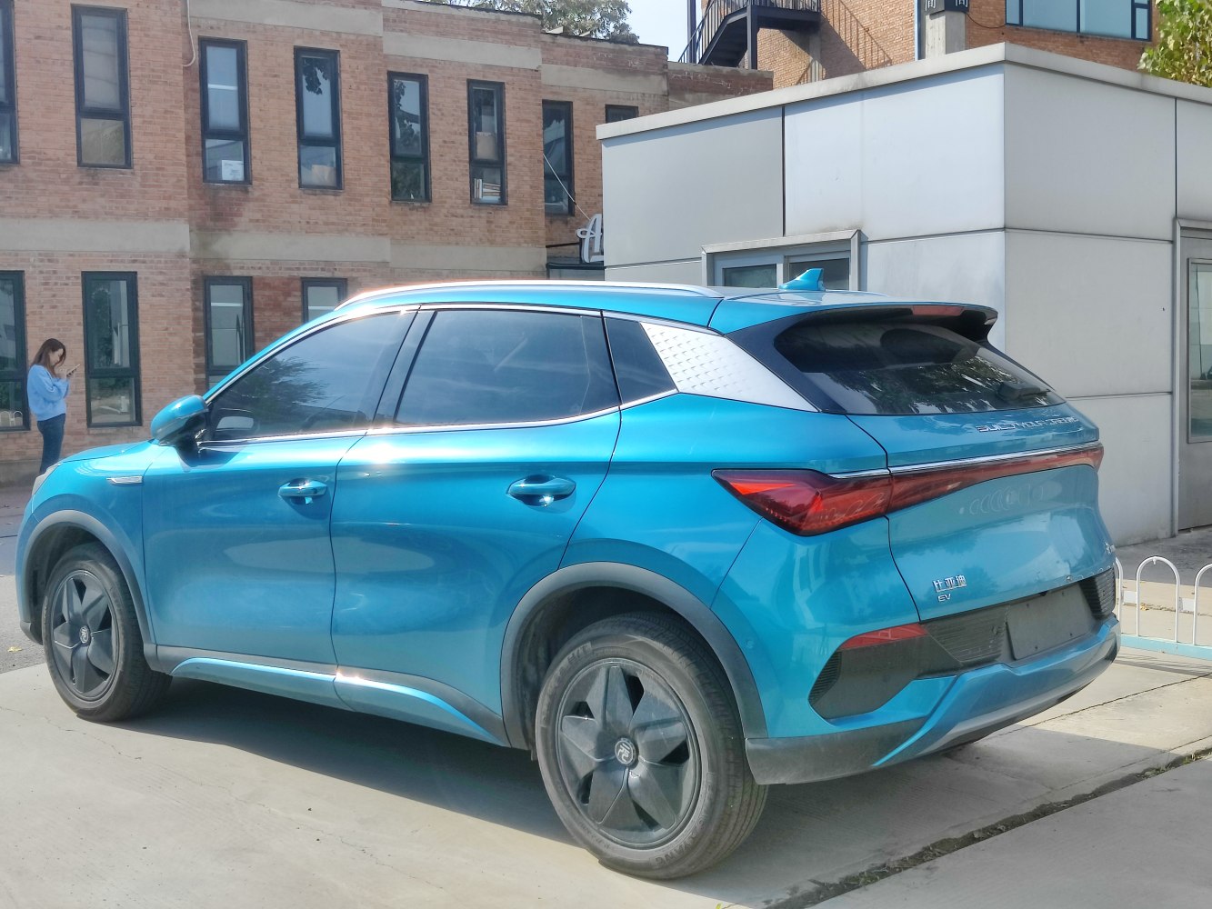 Blue compact SUV with sleek rear LED tail light and aerodynamic roofline