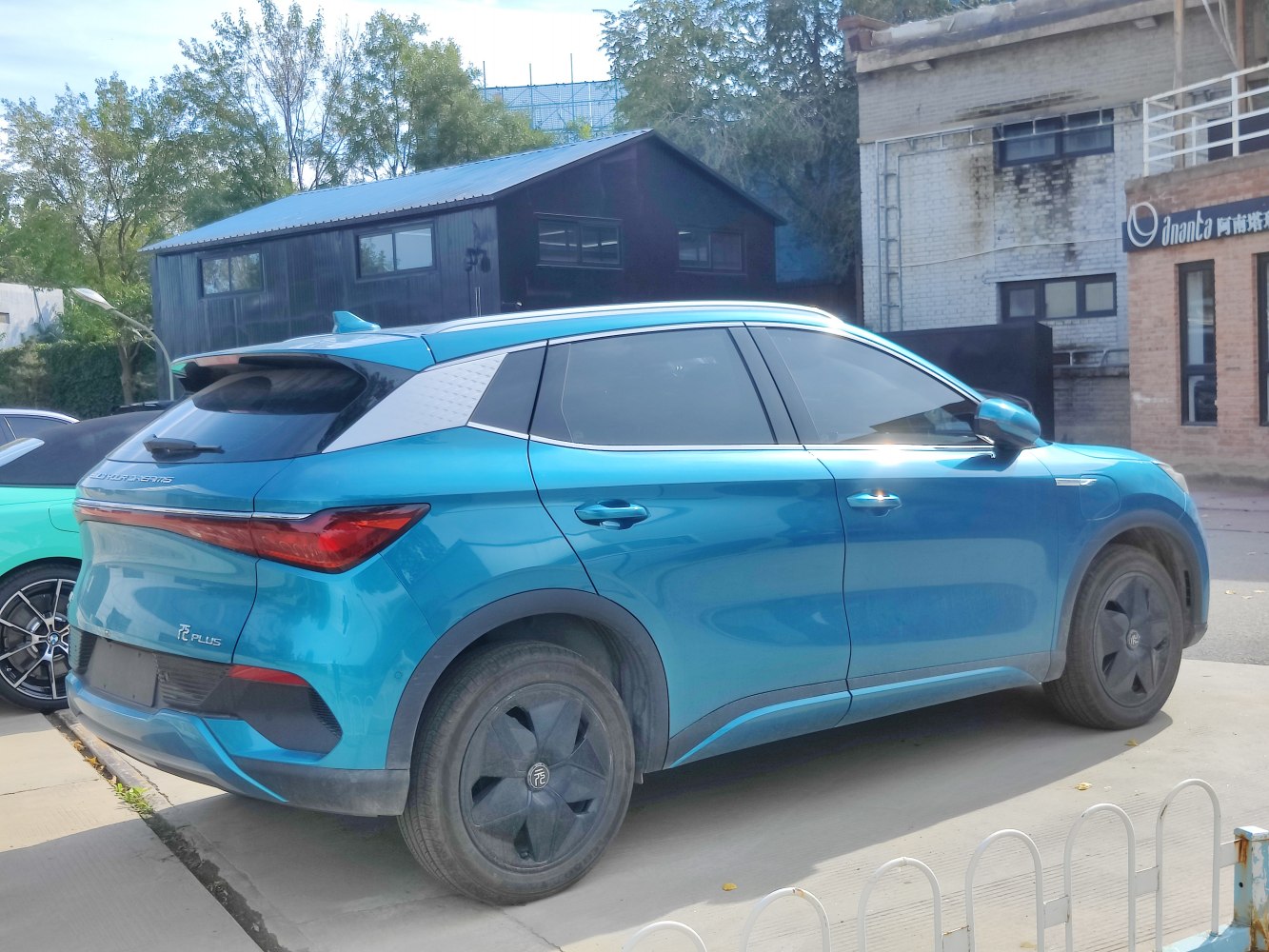 Electric SUV rear and side view with aerodynamic wheels and sleek design