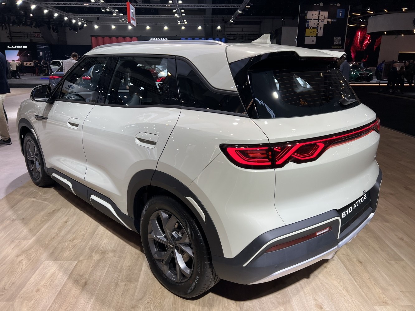 Rear view of a modern electric SUV with distinctive LED tail lights.