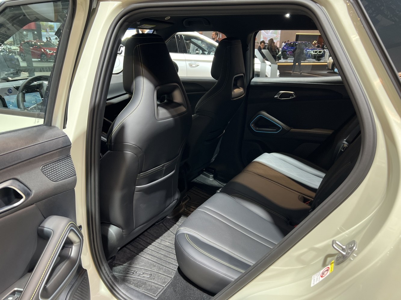 Rear passenger seat and modern interior door panel