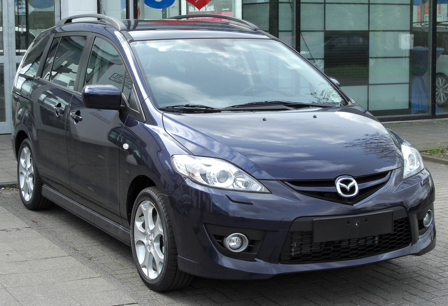Front angled view with sleek headlights and silver alloy wheels