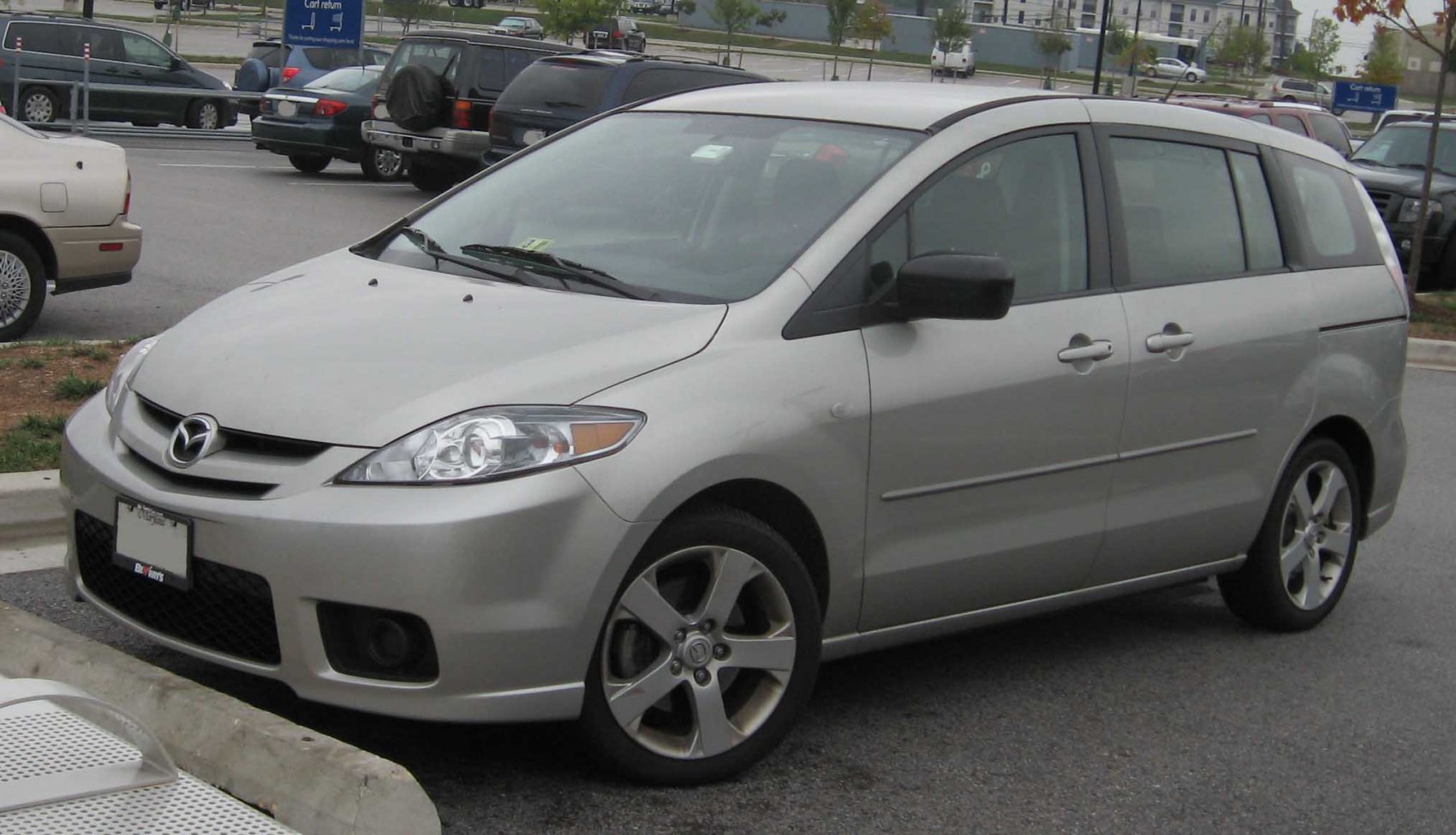 Silver minivan front-side view with alloy wheels