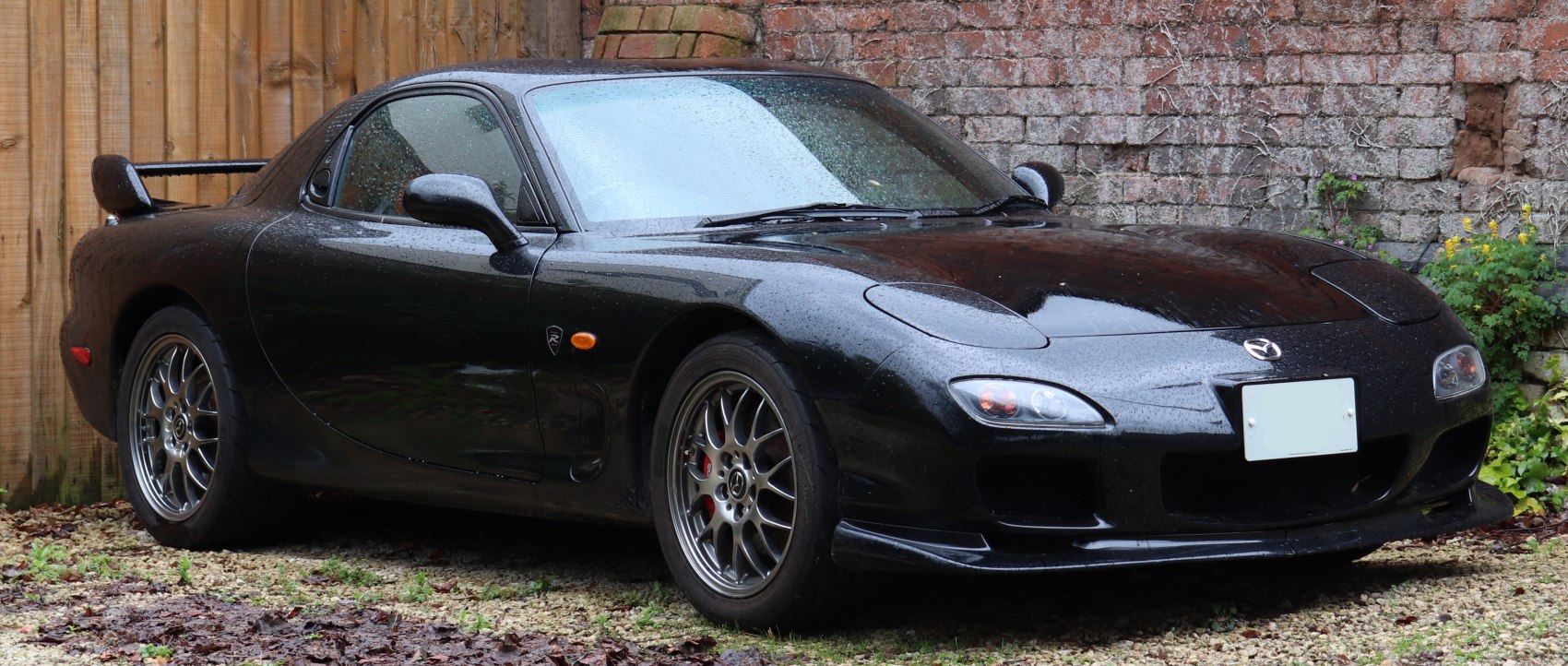 Sleek sports coupe with pop-up headlights and rear spoiler