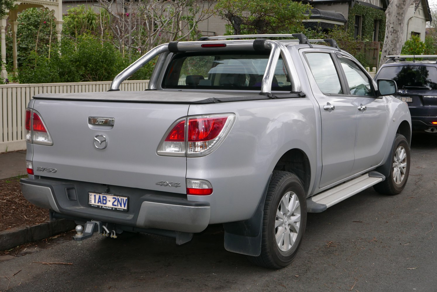 Pickup rear with roll bar and tonneau cover