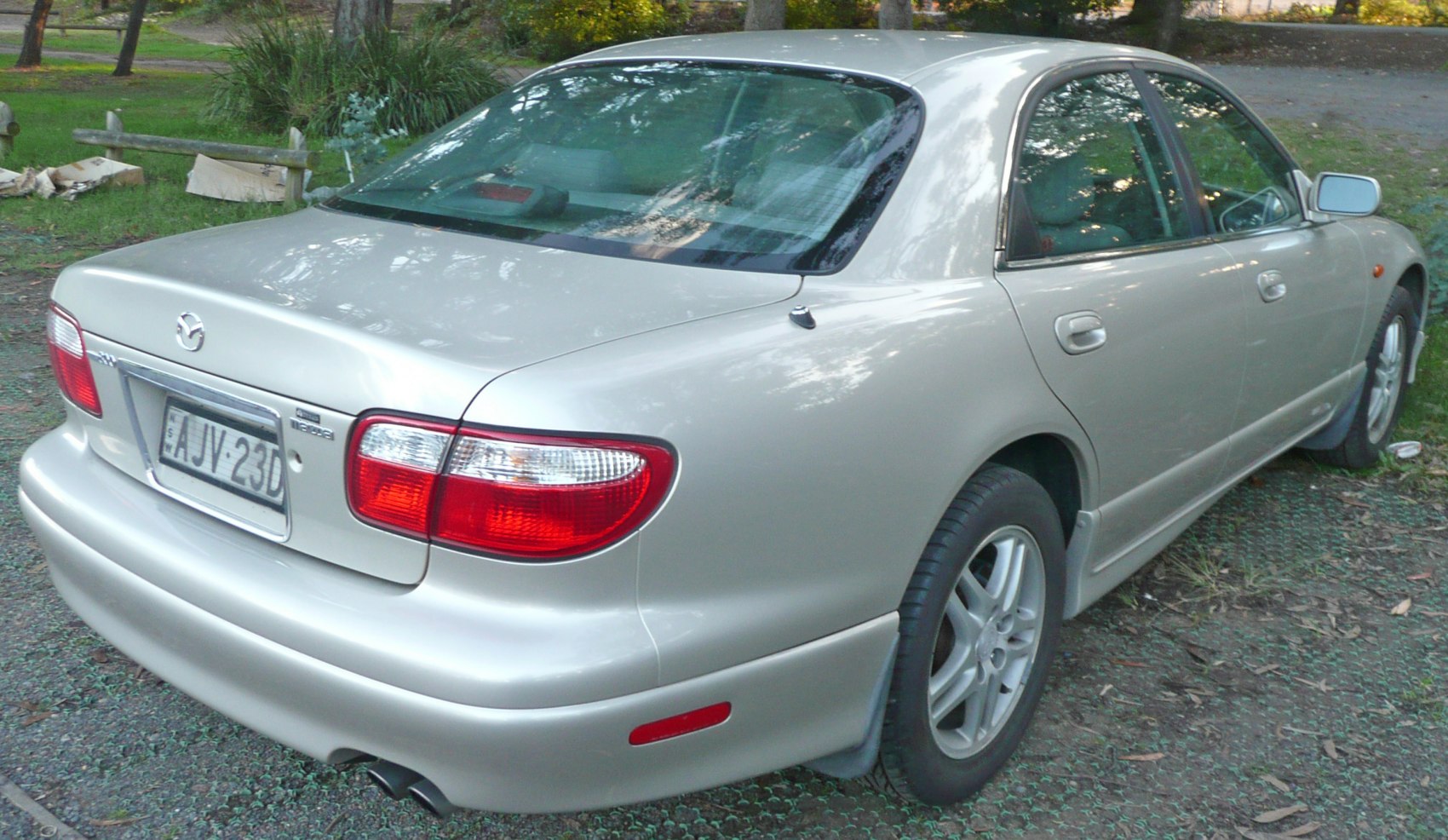 Rear-side view of sedan highlighting tail lights and bumper