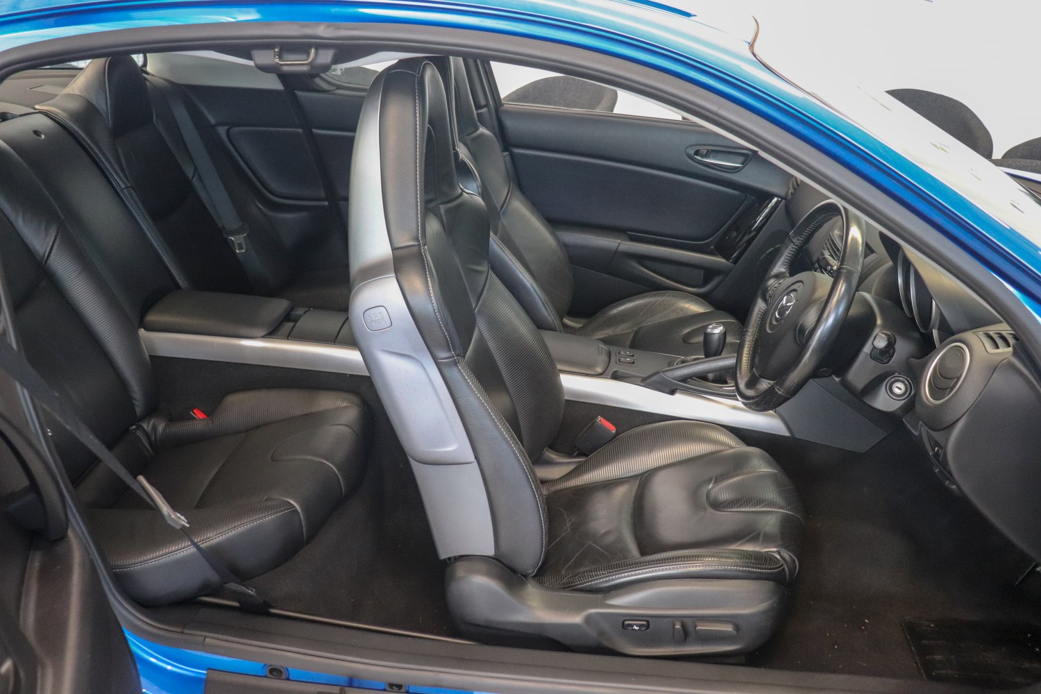 Black leather sport seats and sleek dashboard interior.