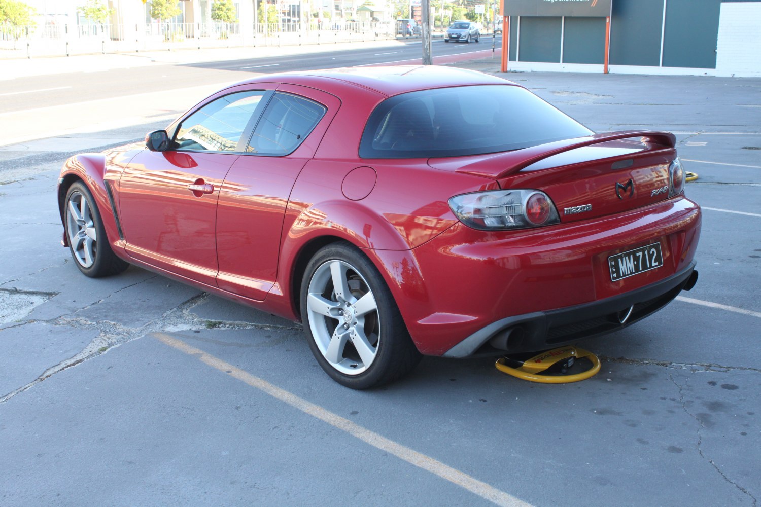 Rear view with spoiler and alloy wheels