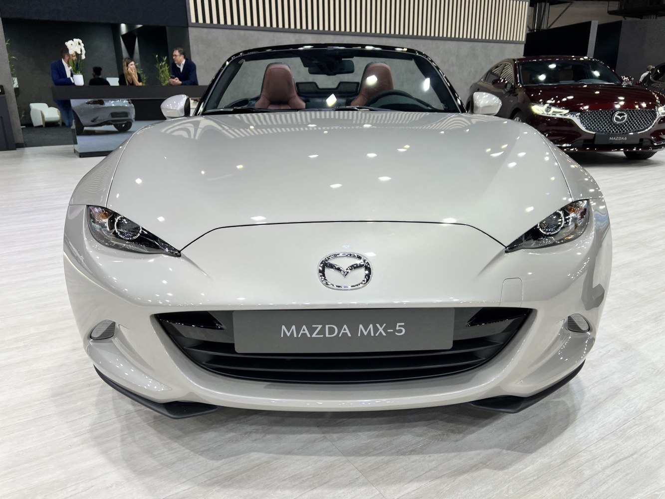 Front view with sleek headlights and grille from a modern convertible roadster