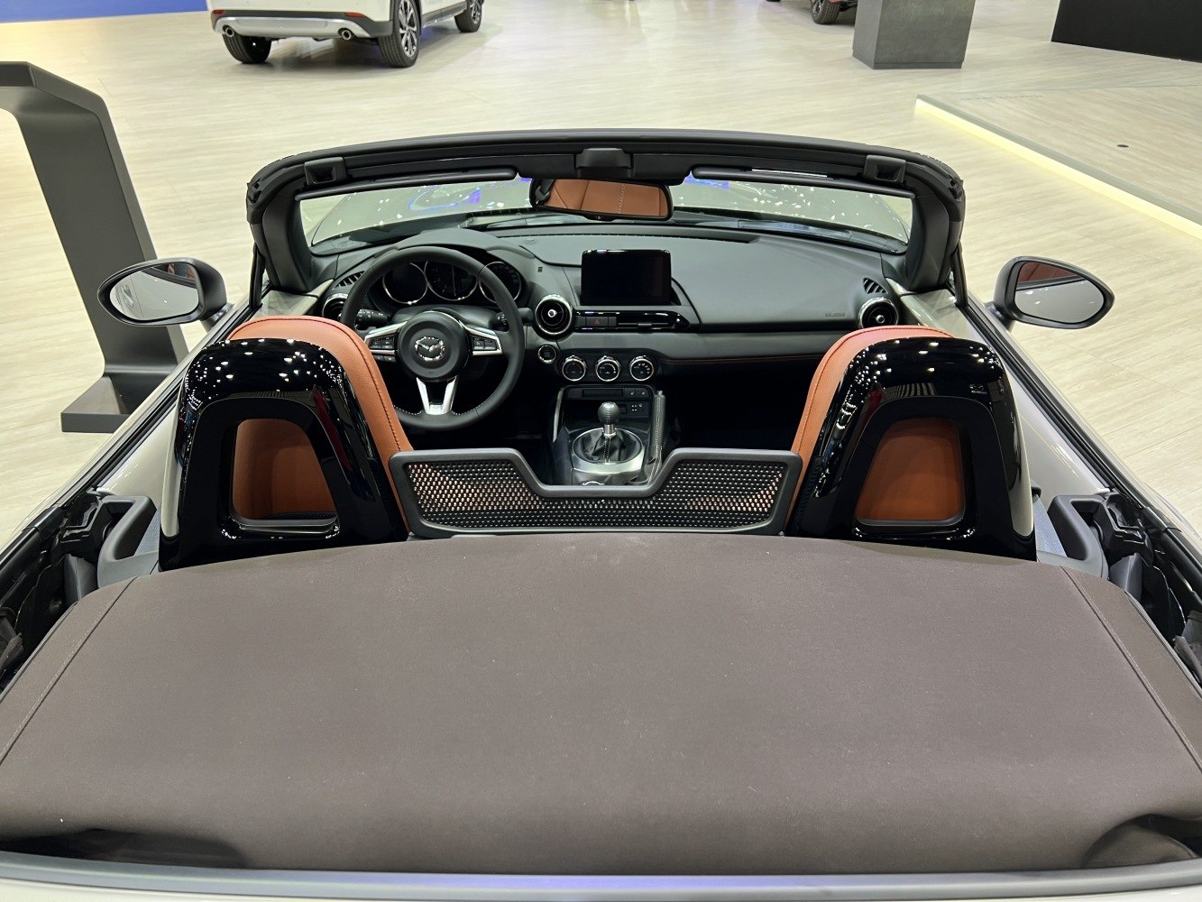 Convertible roadster interior with manual gear and brown seats