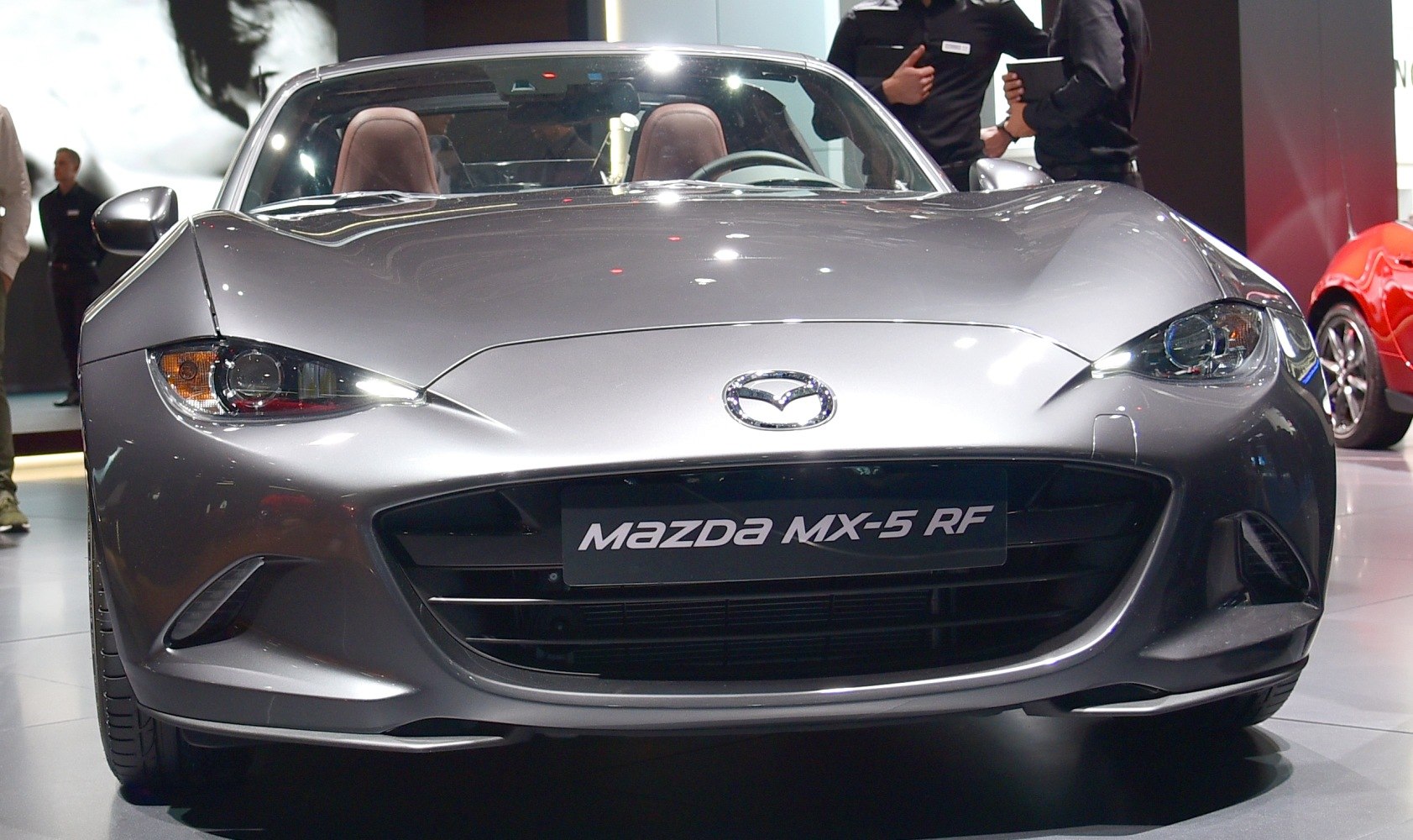 Front view with sleek headlights and signature grille