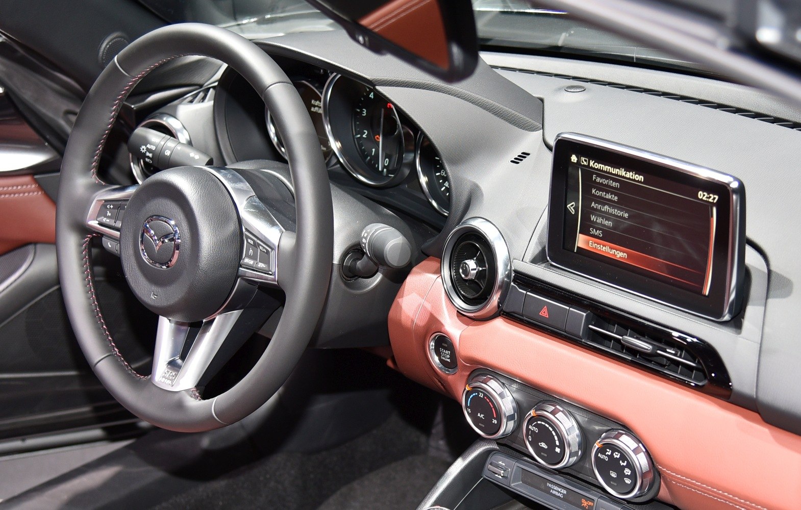 Steering wheel, infotainment screen, climate control dials