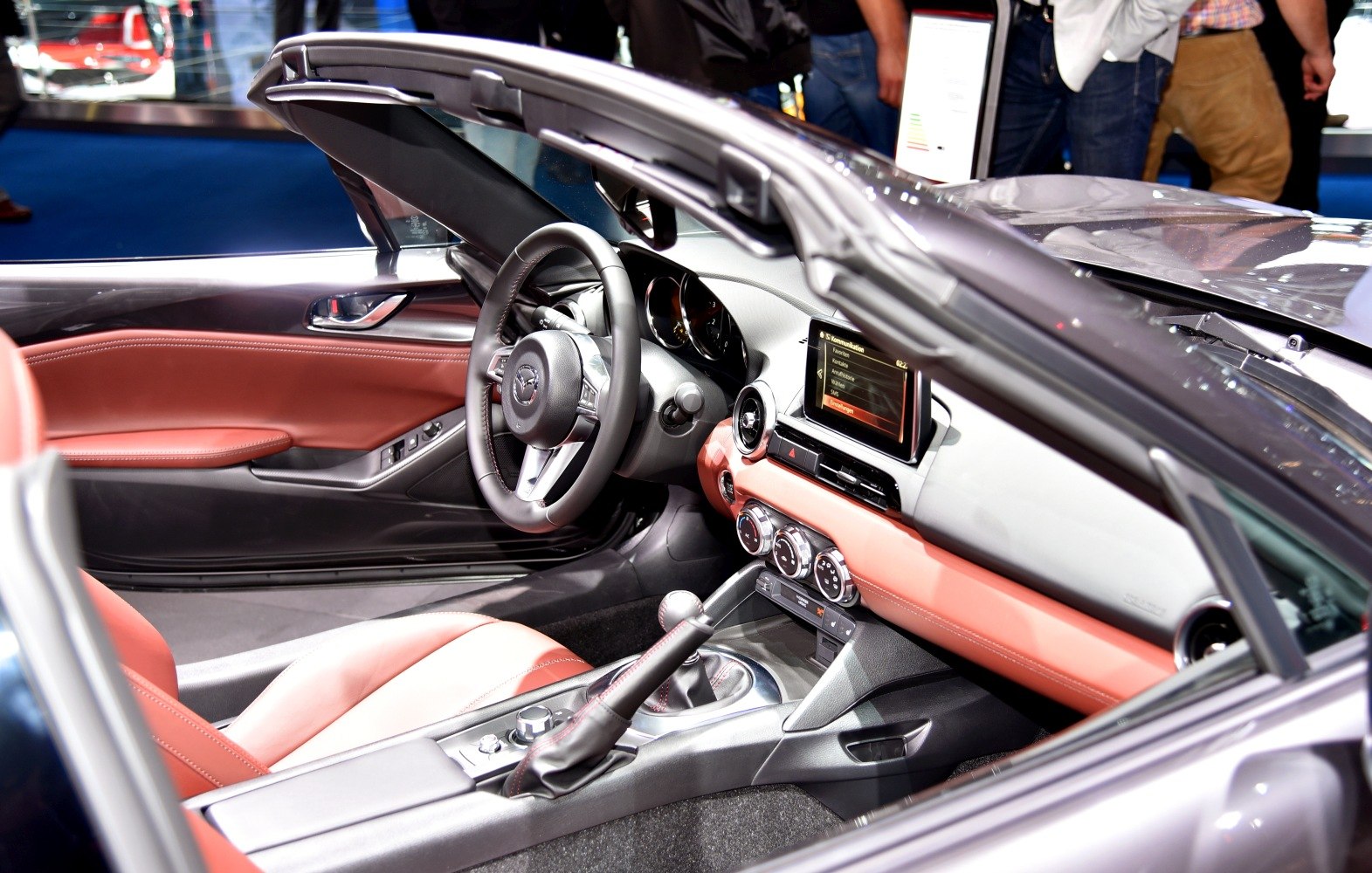 Red leather seats and modern dashboard with touchscreen infotainment