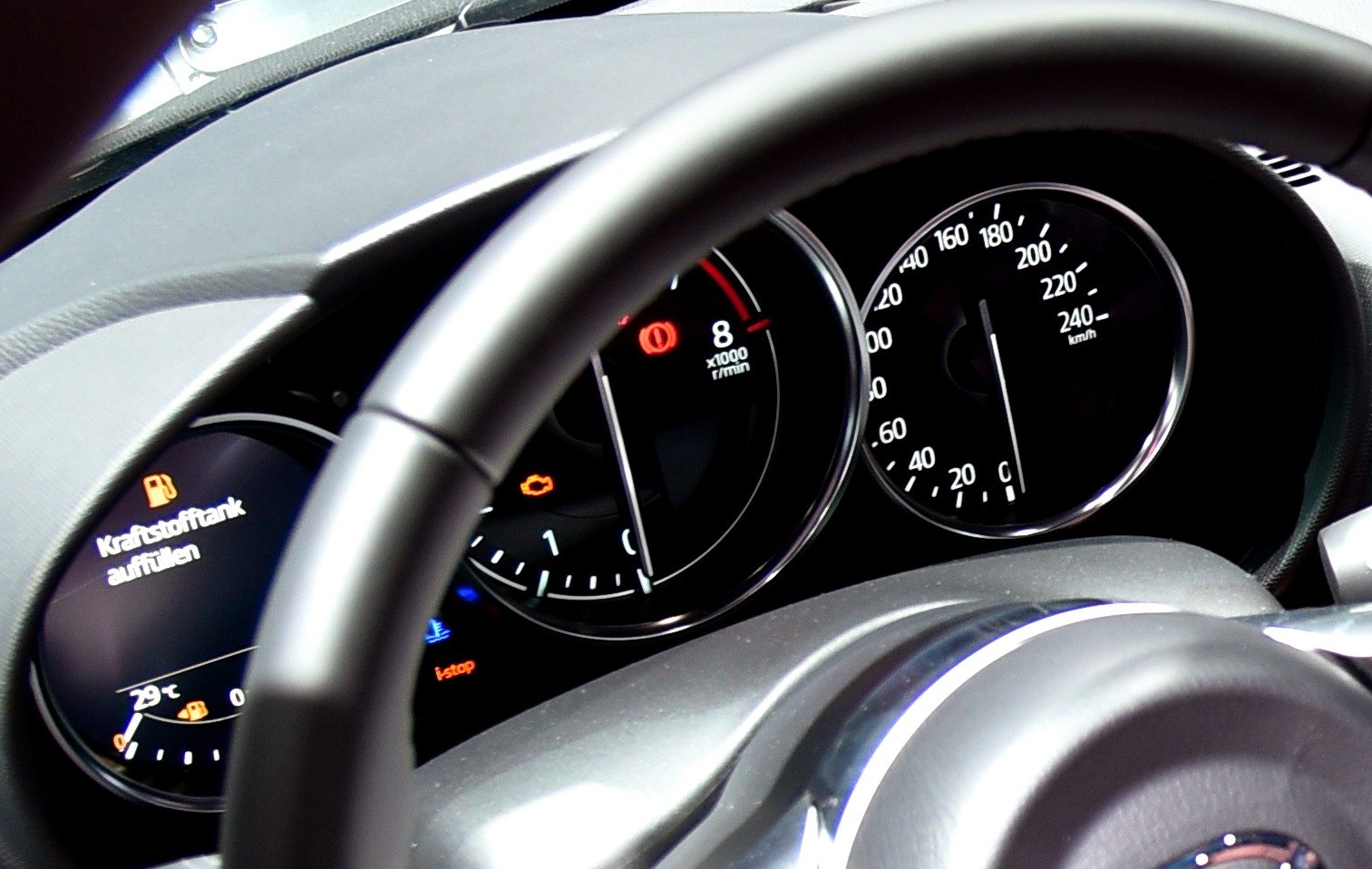 Instrument cluster with speedometer, tachometer, and dashboard warning lights
