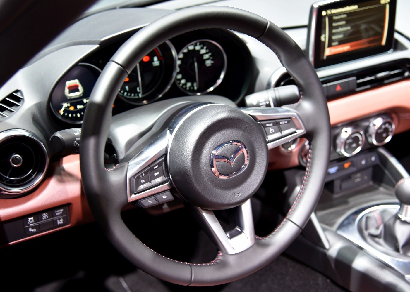 Steering wheel, dashboard gauges, and center console controls