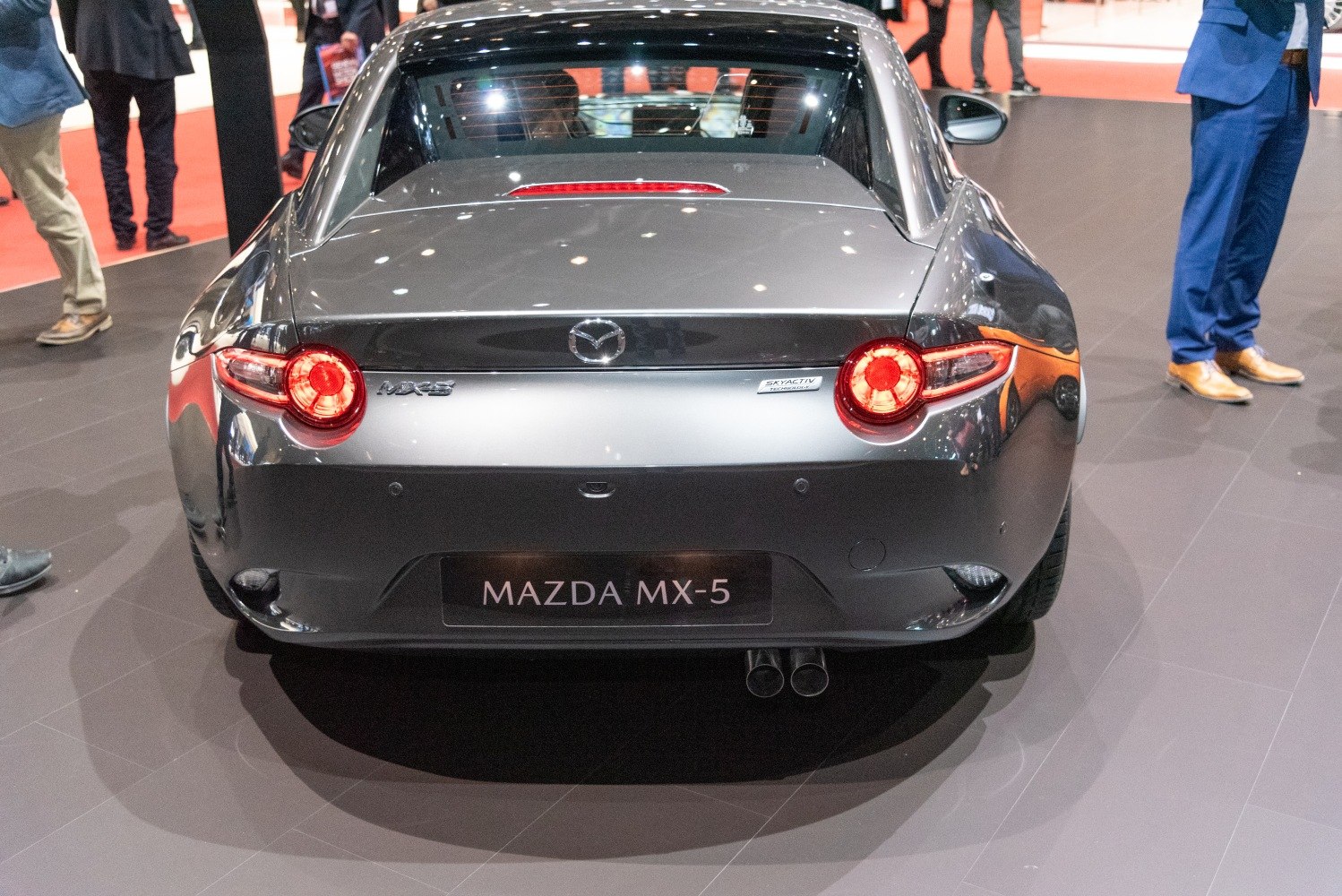 Rear view with round tail lights and dual exhaust pipes