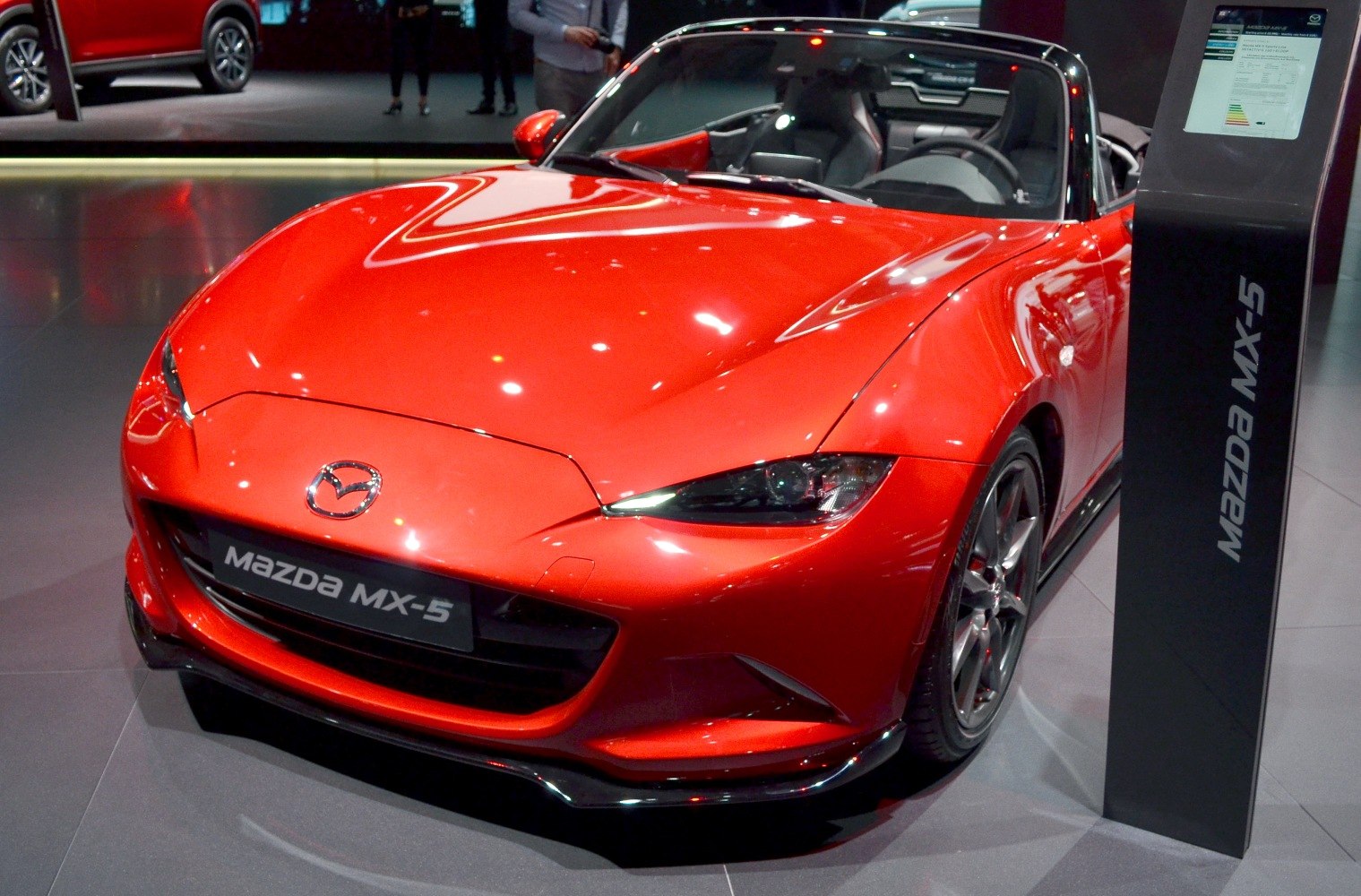 Red convertible sports car with sleek headlights