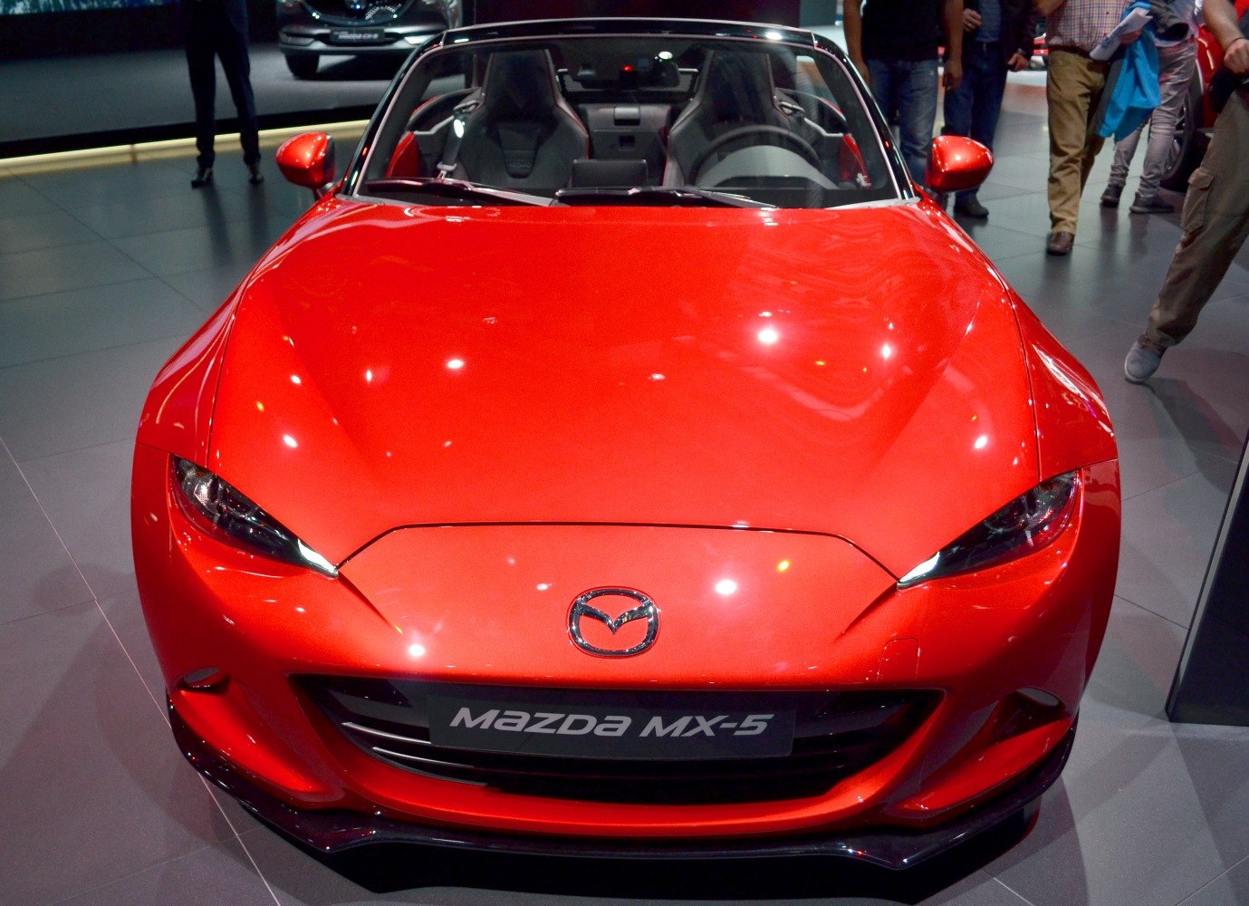 Red front view with sleek headlights and sport seats