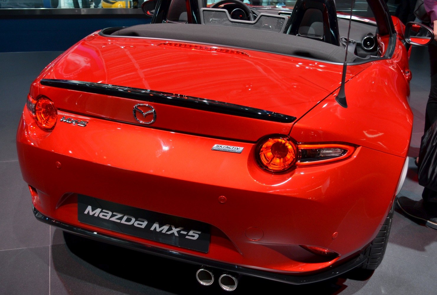 Red convertible rear with round tail lights and dual exhaust