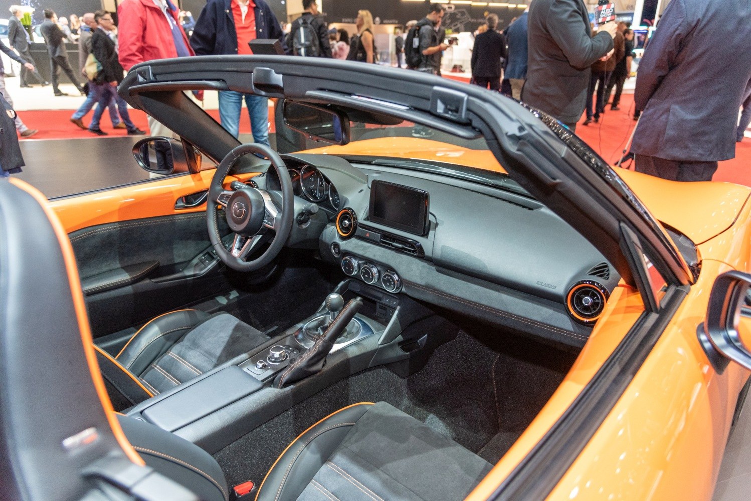 Sporty convertible interior with curved dashboard and detailed seating