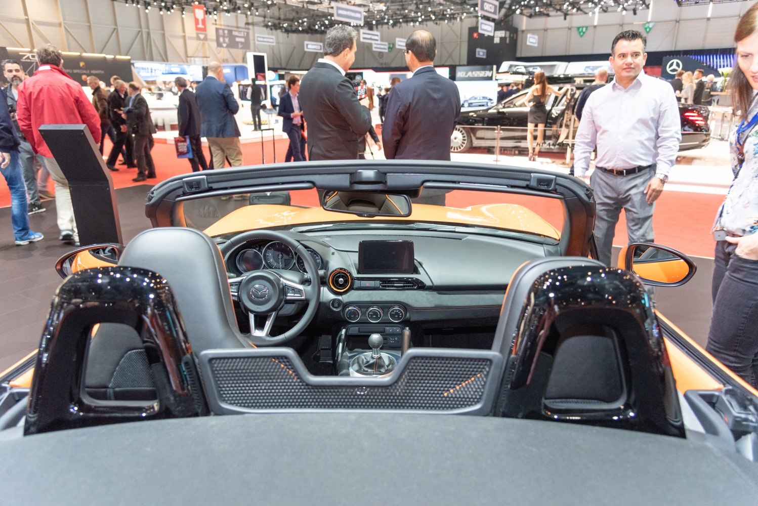 Convertible sports car interior with dashboard and manual gear shift