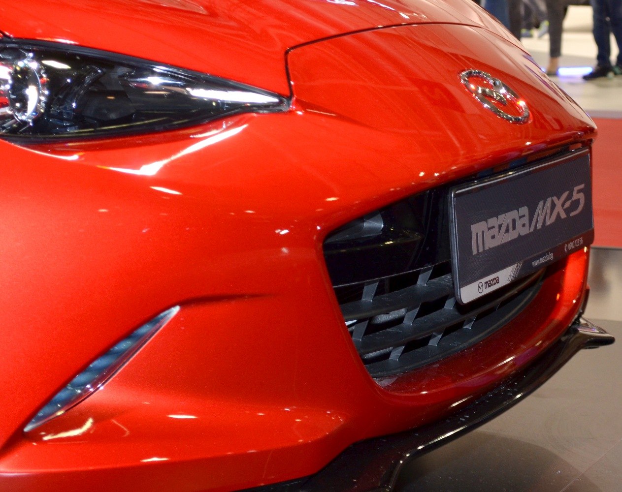 Front grille and headlight close-up on sleek sporty car front
