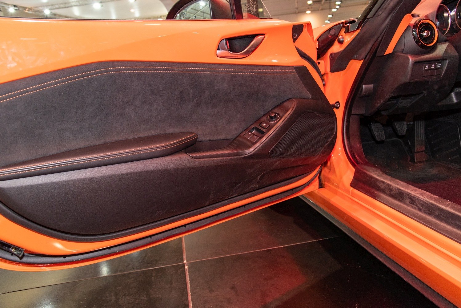 Interior door panel with controls and material details