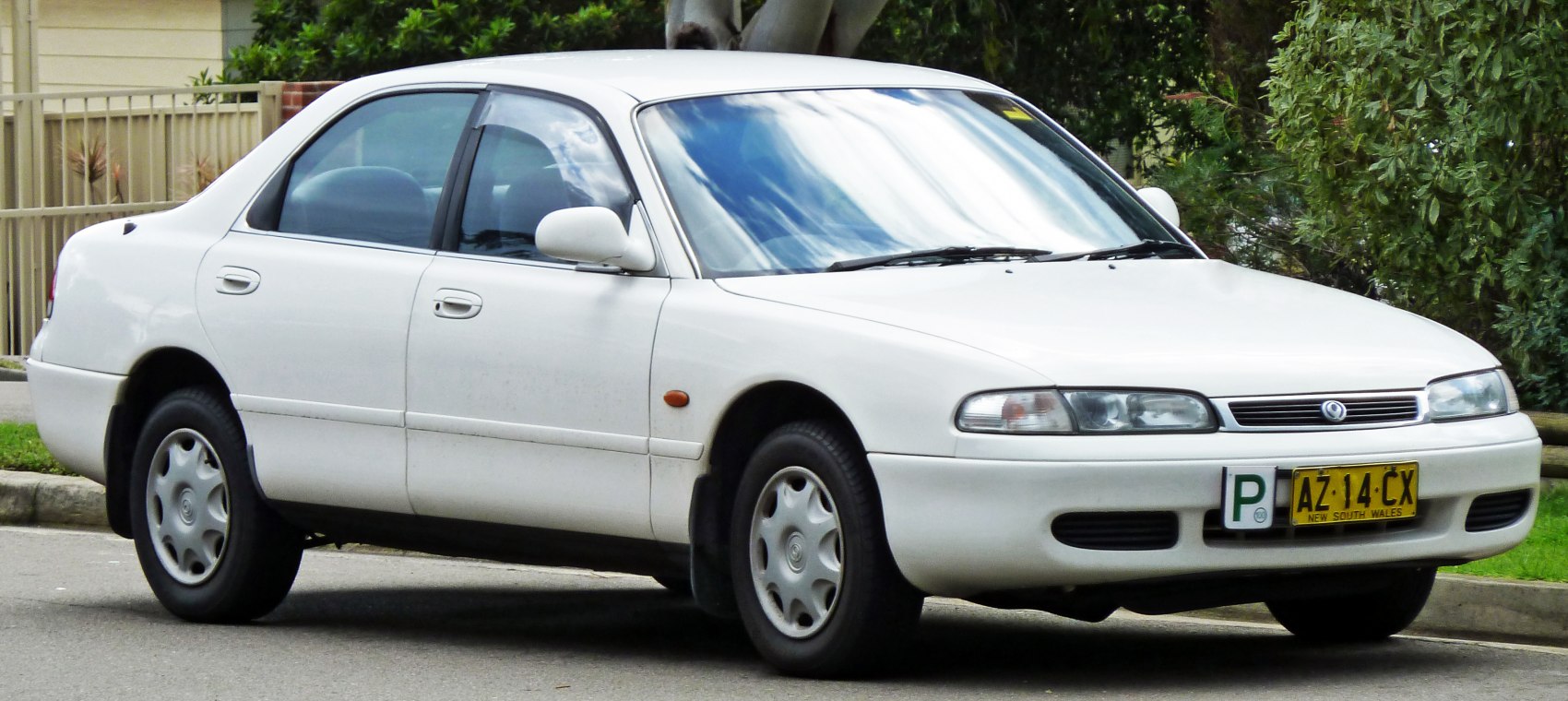Four-door sedan with smooth body lines and flush headlights